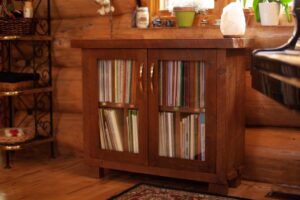 Custom wooden display cabinet with glass insert doors.