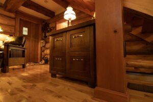 Custom wooden furniture piece with 4 square drawers for storage in living room.