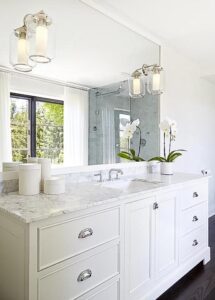 Custom wooden cabinet under the sink in bathroom.